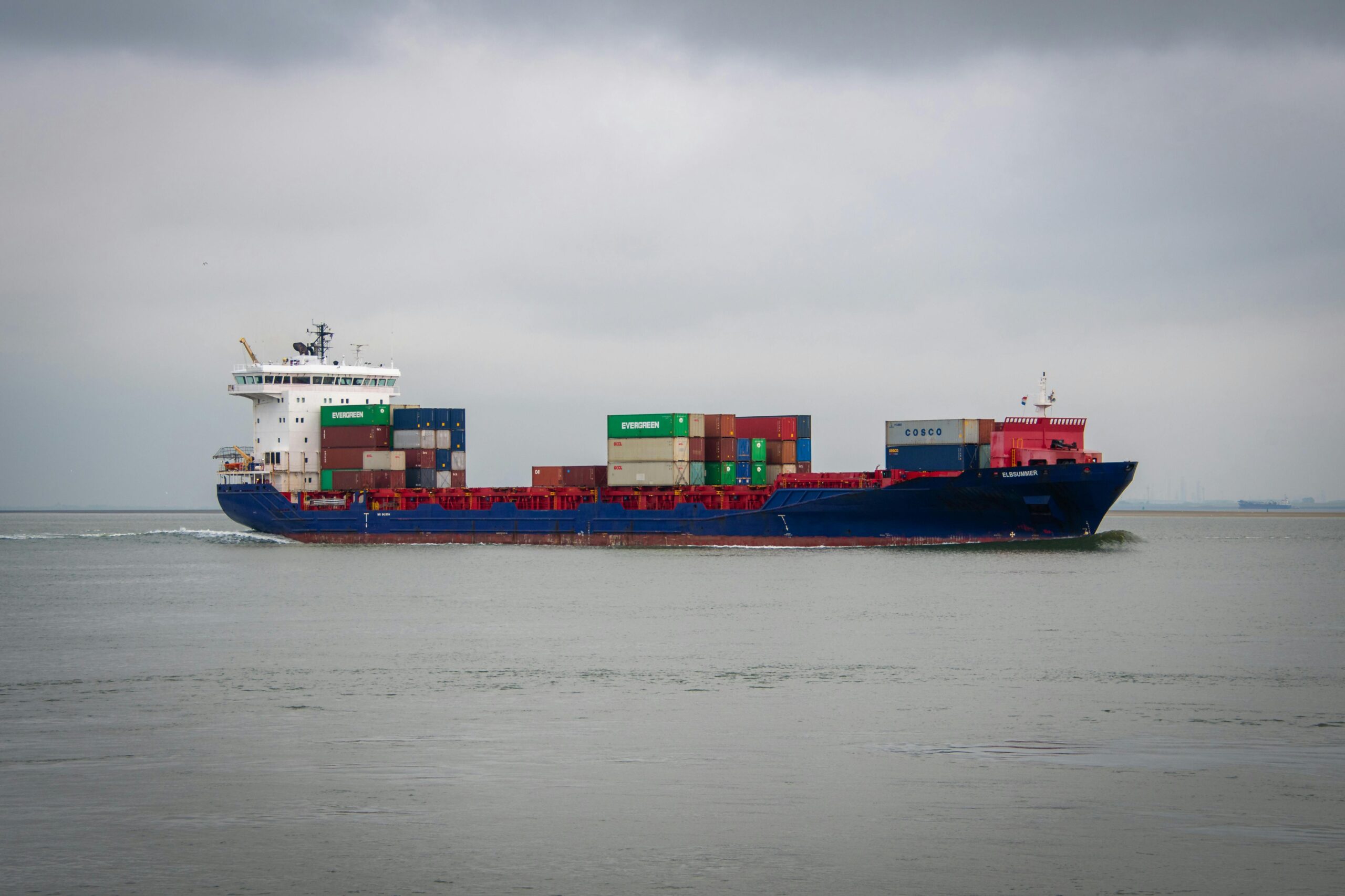 a cargo ship carrying containers on the ocean near terneuzen, netherlands.