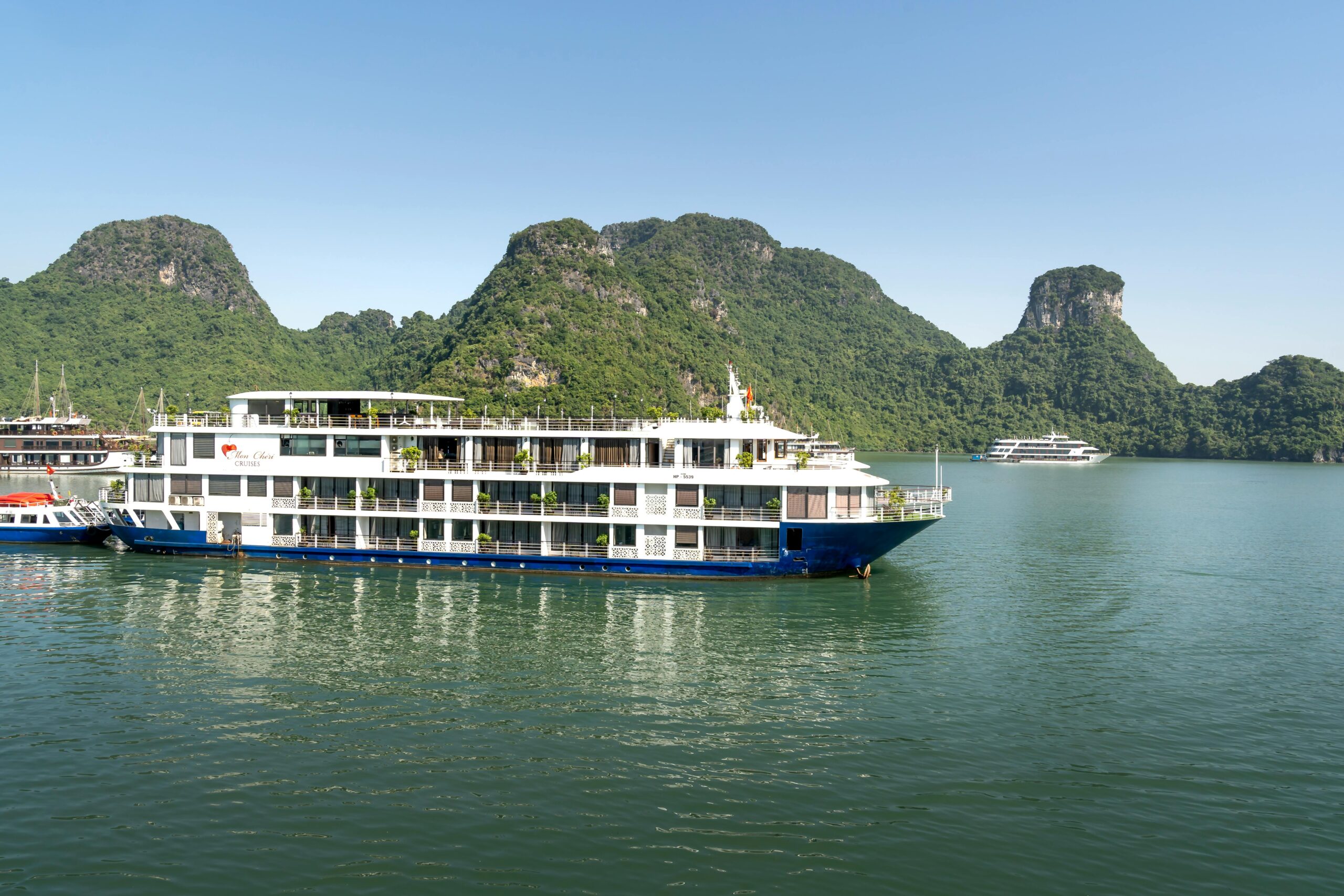explore tranquil waters with a picturesque cruise ship in stunning halong bay, vietnam.