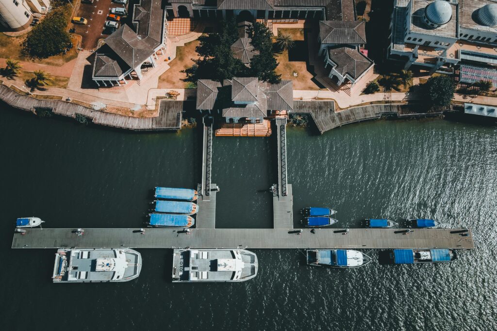 aerial view of the bustling pier in kuala terengganu, malaysia, showcasing boats docked along the waterfront.